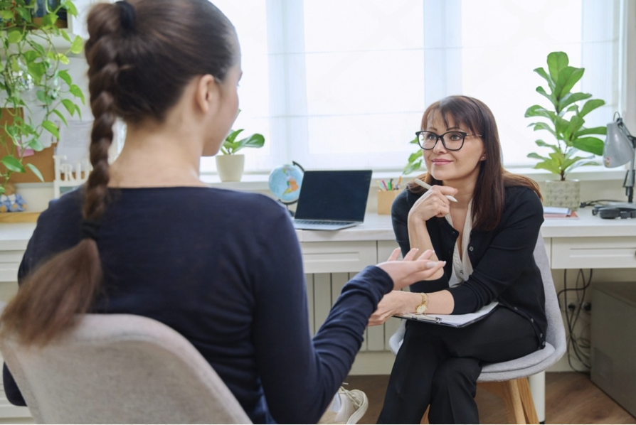 Psychologist talking with a client during a psychological assessment