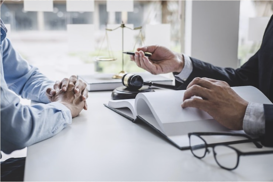 Gavel and scales of justice on a desk during a legal consultation
