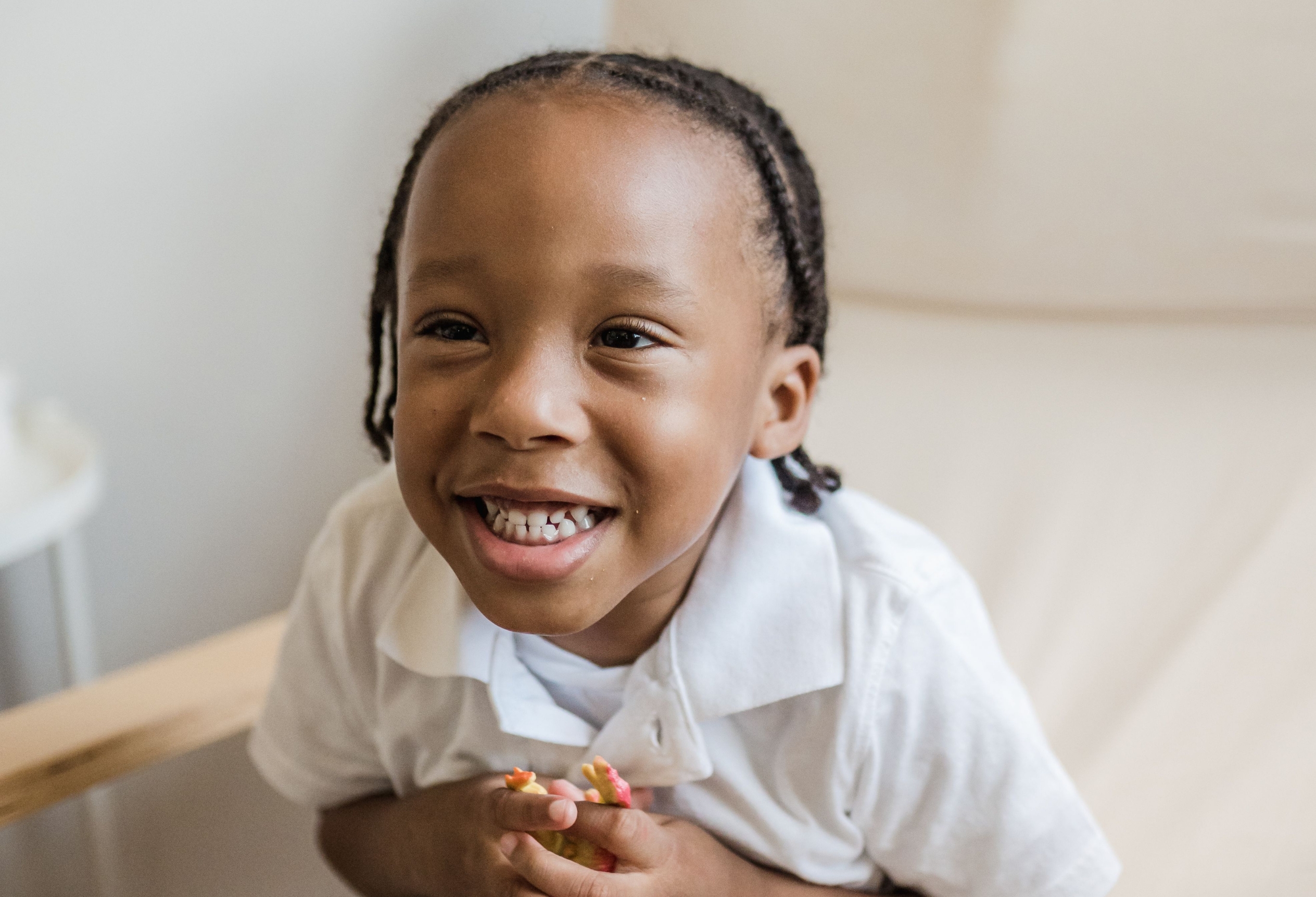 Young child laughing, child therapy at Unfold Psychology